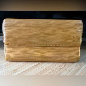 Authentic Louis Vuitton epi yellow, and purple, leather wallet.